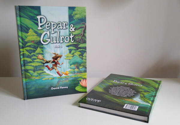 A photo of a thick and large colored comic book 'Pepar  Gulrot' by David Revoy.