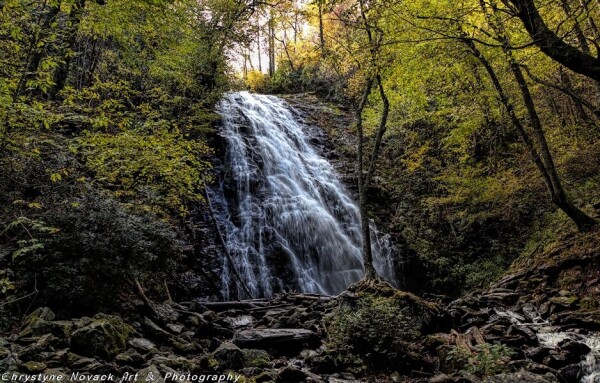 Cradled between the fall foliage of yellows, golds and greens the cascading waters of Crabtree Falls in the Blue Ridge Mountains is a welcome sight after a mile and a half hike.