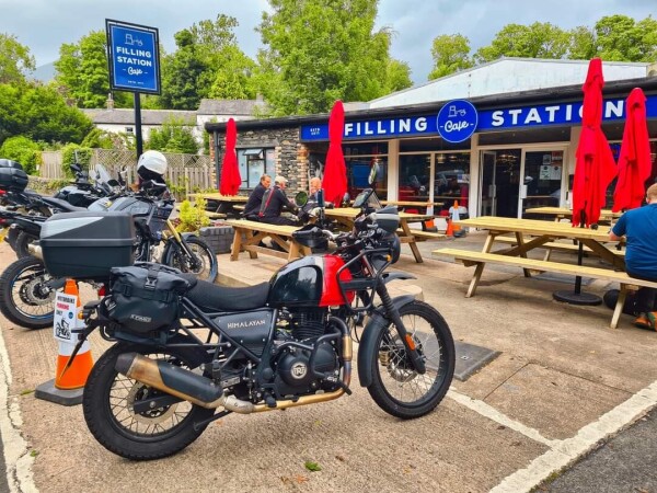 Red Himalayan motorbike parked outside the filling station cafe