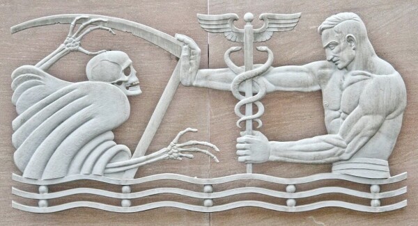 A frieze showing Death as a skeleton on the left, and Medicine as a man on the right holding Death back. The man, representing Medicine, is holding a caduceus, the symbol of commerce. 