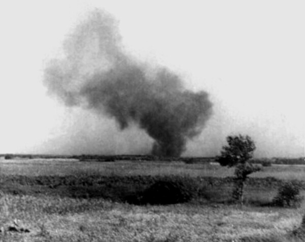 Burning Treblinka II perimeter during the prisoner uprising, 2 August 1943. Barracks were set ablaze, including a tank of petrol which exploded setting fire to the surrounding structures. This clandestine photograph was taken by Franciszek Ząbecki. By Franciszek Ząbecki - Kopówka, Edward; Rytel-Andrianik, Paweł (2011), &quot;Treblinka II – Obóz zagłady&quot; [Monograph, chapt. 3: Treblinka II Death Camp] (PDF file, direct download 20.2 MB).Franciszek Ząbecki, Wspomnienia dawne i nowe, Instytut Wydawniczy PAX, fotografia pomiędzy stronami 48 i 49/photo between pages 112 and 113, Public Domain, https://commons.wikimedia.org/w/index.php?curid=30460279