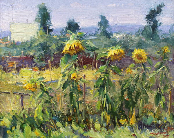 Painting of five high yellow sunflowers, with many leaves in various shades of green in the foreground. The soil they are standing on is covered with abstract light green coloured foliage. Behind the sunflowers is a light brown and yellow coloured field with some touches of purple in it. In the background are  abstract shapes of purple and bordeaux coloured nature, and four rather dark green pine trees behind that. On the left in the background is a white shed. On the horizon is the shape of a purple hill. The sky is coloured in shades of light purple.