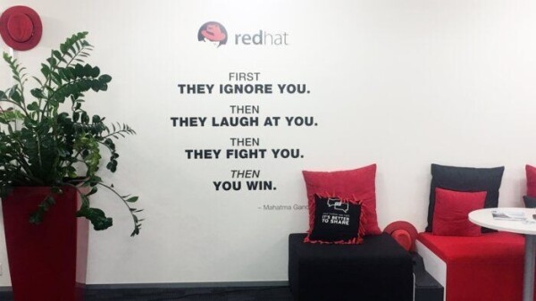 Photograph of a Red Hat office showing the misattributed quote painted on the wall.