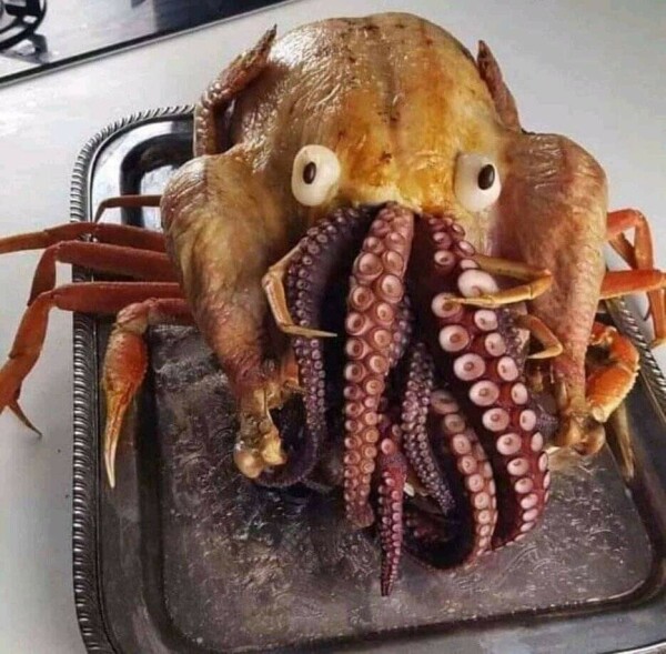 Crab legs, turkey, and cephalopod tentacles arranged to form Cthulhu 