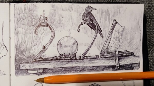 A ballpoint pen drawing from my sketchbook: a first thumbnail of the 2024 with candle, a crow, a crystal ball and a book on a table.