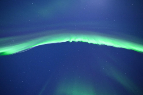 Northern Lights in bright green over North Pole, Alaska.
