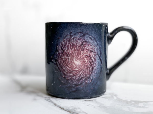 Mug featuring galaxy with magnetic fields