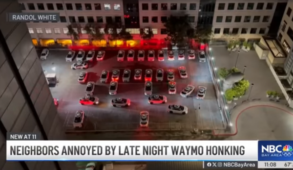 Clip from video showing Waymo cars honking at each other late at night in a parking lot