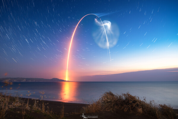 2020 February 28

South Celestial Rocket Launch
 * Image Credit & Copyright: Brendan Gully

Explanation: 
At sunset on December 6 a Rocket Lab Electron rocket was launched from a rotating planet. With multiple small satellites on board it departed on a mission to low Earth orbit dubbed Running Out of Fingers from Mahia Peninsula on New Zealand's north island. The fiery trace of the Electron's graceful launch arc is toward the south in this southern sea and skyscape. Drifting vapor trails and rocket exhaust plumes catch the sunlight even as the sky grows dark though, the setting Sun still shinning at altitude along the rocket's trajectory. Fixed to a tripod, the camera's perspective nearly aligns the peak of the rocket arc with the South Celestial Pole, but no bright star marks that location in the southern hemisphere's evening sky. Still, it's easy to find at the center of the star trail arcs in the timelapse composite. 

Authors & editors: Robert Nemiroff (MTU) & Jerry Bonnell (UMCP)
NASA Official: Phillip Newman Specific rights apply.
NASA Web Privacy Policy and Important Notices
A service of: ASD at NASA / GSFC
& Michigan Tech. U.