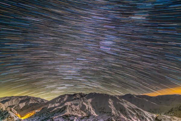 2018 March 2

Alborz Mountain Star Trails
 * Image Credit & Copyright: Stéphane Guisard (Los Cielos de America, TWAN)

Explanation: 
Colourful star trails arc through the night in this wide-angle mountain and skyscape. From a rotating planet, the digitally added consecutive exposures were made with a camera fixed to a tripod and looking south, over northern Iran's Alborz Mountain range. The stars trace concentric arcs around the planet's south celestial pole, below the scene's rugged horizon. Combined, the many short exposures also bring out the pretty star colours. Bluish trails are from stars hotter than our Sun, while yellowish trails are from cooler stars. Near the center, the remarkably pinkish trail was traced by the star-forming Orion Nebula. 

Authors & editors: Robert Nemiroff (MTU) & Jerry Bonnell (UMCP)
NASA Official: Phillip Newman Specific rights apply.
NASA Web Privacy Policy and Important Notices
A service of: ASD at NASA / GSFC
& Michigan Tech. U.