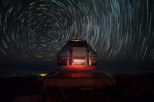 2016 October 15

Gemini Observatory North
 * Image Credit & Copyright: Joy Pollard (Gemini Observatory)

Explanation: 
It does look like a flying saucer, but this technologically advanced structure is not here to deliver the wise extraterrestrial from the scifi classic movie The Day the Earth Stood Still. It is here to advance our knowledge of the Universe though. Shown sitting near the top of a mountain in Hawaii, the dome of the Gemini Observatory North houses one of two identical 8.1-meter diameter telescopes. Used with its southern hemisphere twin observatory in Chile, the two can access the entire sky from planet Earth. Constructed from 85 exposures lasting 30 seconds each with camera fixed to a tripod, the image also clearly demonstrates that the Earth did not stand still. Adjusted to be brighter at the ends of their arcs, the concentric star trails centered on the North Celestial Pole are a reflection of Earth's rotation around its axis. Close to the horizon at Hawaiian latitudes, Polaris, the North Star, makes the shortest star trail. The fainter denser forest of star trails toward the right is part of the rising Milky Way. 

Authors & editors: Robert Nemiroff (MTU) & Jerry Bonnell (UMCP)
NASA Official: Phillip Newman Specific rights apply.
NASA Web Privacy Policy and Important Notices
A service of: ASD at NASA / GSFC
& Michigan Tech. U.