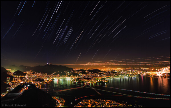 2014 June 20

Rio at Night
 * Image Credit & Copyright: Babak Tafreshi (TWAN)

Explanation: 
In this night skyscape setting stars trail above the western horizon over Rio de Janeiro, Brazil, a venue for the 2014 World Cup. Gentle arcs from the bright, colorful stars of Orion are near the center of the frame, while the starfield itself straddles planet Earth's celestial equator during the long exposure. Of course, trails from more local lights seem to create the strident paths through the scene. Air traffic smears an intense glow over an airport at the far right, while helicopters fly above the city and boats cruise near the coast. Striping the waterfront are tantalizing reflections of bright lights along Rio's central beaches, Botafogo and Flamengo. Near the horizon, the brightest fixed light is the famous Cristo statue overlooking Rio at night. 

Authors & editors: Robert Nemiroff (MTU) & Jerry Bonnell (UMCP)
NASA Official: Phillip Newman Specific rights apply.
NASA Web Privacy Policy and Important Notices
A service of: ASD at NASA / GSFC
& Michigan Tech. U.

