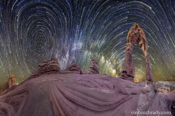 2014 March 17

Warped Sky: Star Trails over Arches National Park
 * Image Credit & Copyright: Vincent Brady

Explanation: 
What's happened to the sky? A time warp, of sorts, and a digital space warp too. The time warp occurs because this image captured in a single frame a two and a half hour exposure of the night sky. As a result, prominent star trails are visible. The space warp occurs because the picture is actually a full 360 degree panorama, horizontally compressed to fit your browser. As the Earth rotated, stars appeared to circle both the North Celestial Pole, on the left, and the South Celestial Pole, just below the horizon on the right. The above panorama over Arches National Park in Utah, USA, was captured two weeks ago during early morning hours. While the eye-catching texture of ancient layered sandstone covers the image foreground, twenty-meter tall Delicate Arch is visible on the far right, and the distant arch of our Milky Way Galaxy is visible near the image center. 

Authors & editors: Robert Nemiroff (MTU) & Jerry Bonnell (UMCP)
NASA Official: Phillip Newman Specific rights apply.
NASA Web Privacy Policy and Important Notices
A service of: ASD at NASA / GSFC
& Michigan Tech. U.