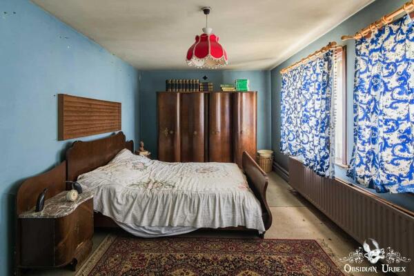 bedroom with blue wallpaper