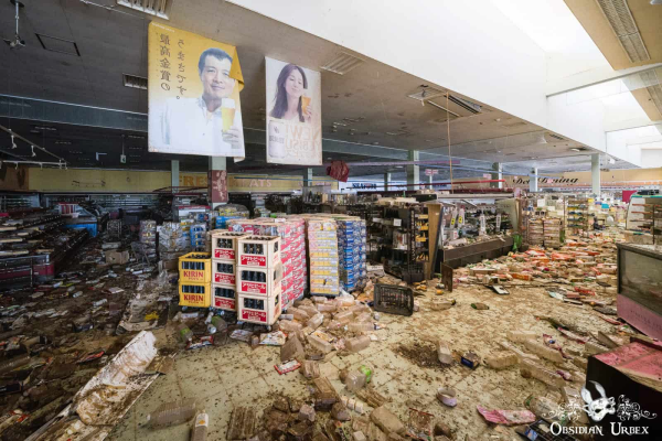 supermarket in ruins, advertisement posters hag from ceiling