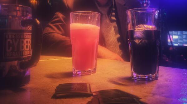 Picture of two fedidrinks. The black one is Owncast and red / orange one is Peertube.