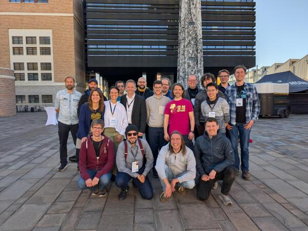 Face team and volunteers posing outside the SFSCON venue