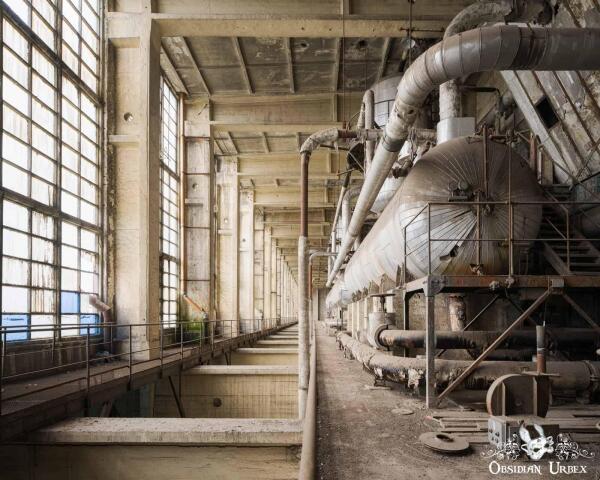 Placeholder An abandoned Hungarian power plant, a vast industrial interior with huge pipes, machinery, and decaying concrete structures